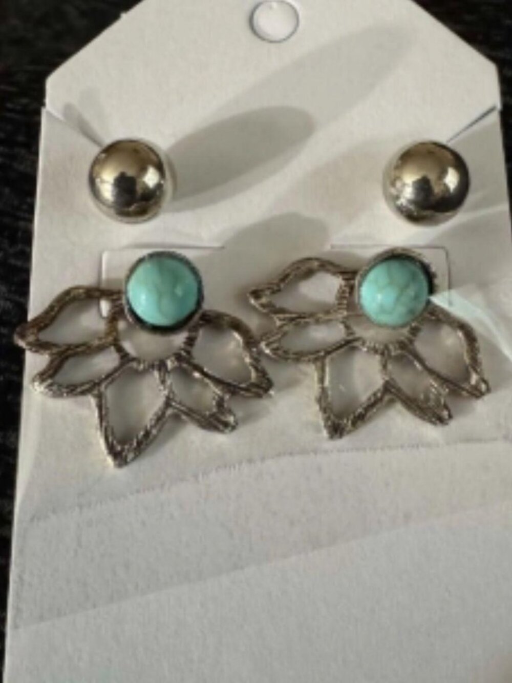 floral earrings feature an open lotus-style flower